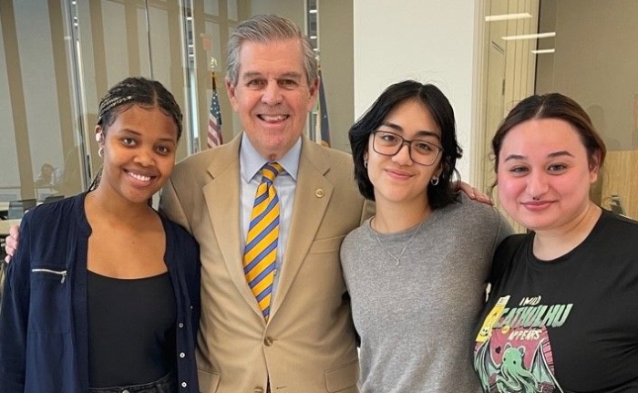 HCC Northwest President Zachary Hodges, Ed.D., meets with students at an event.