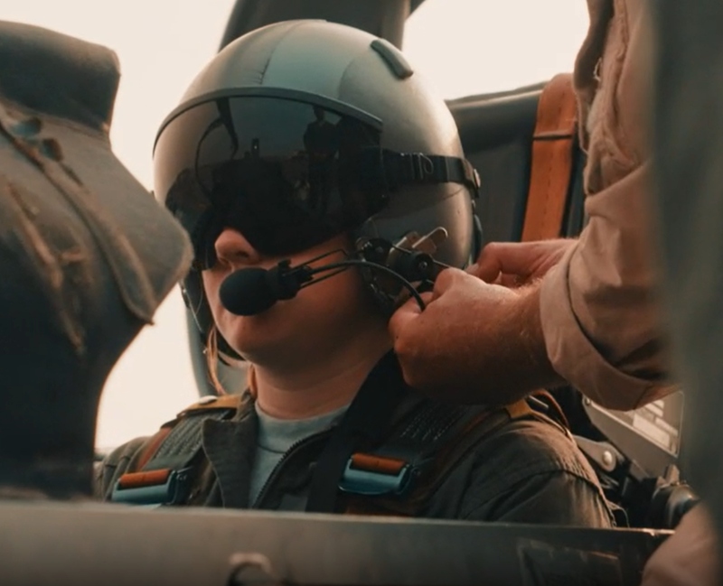 An Air Force ROTC cadet straps into the cockpit of a trainer to take an orientation flight.