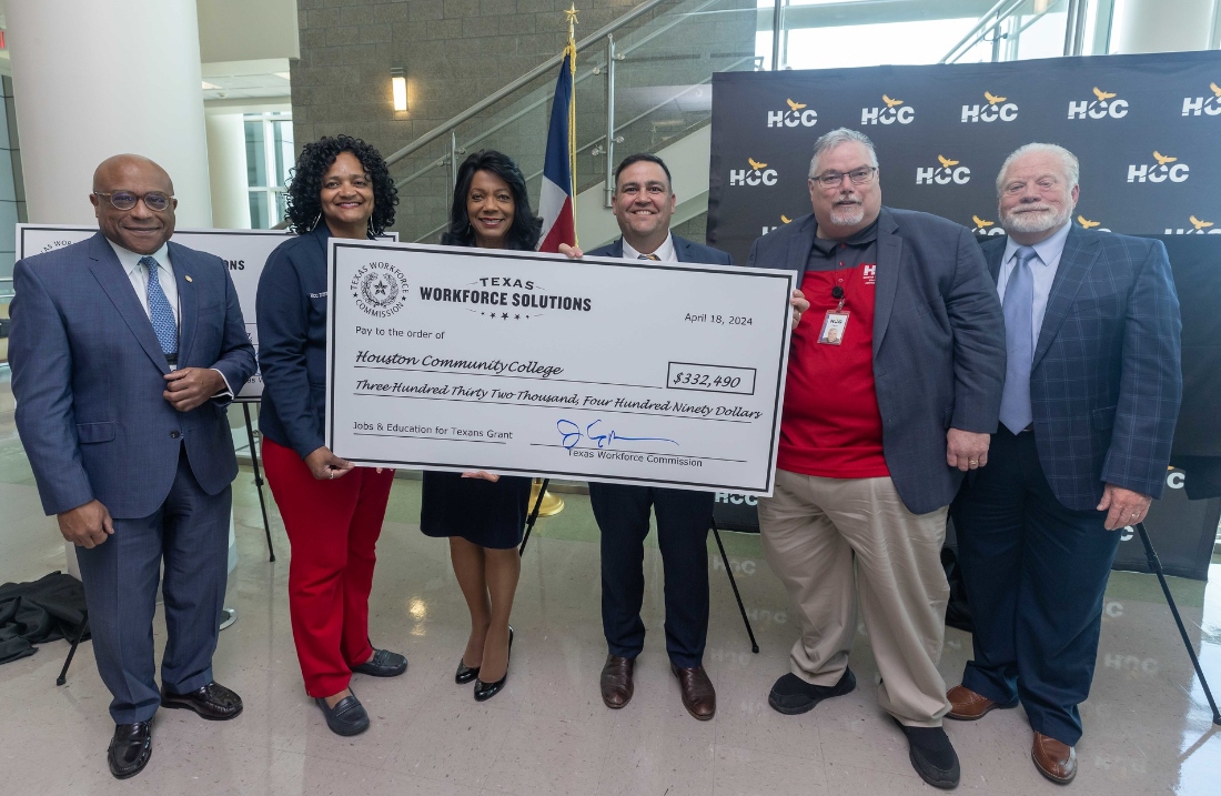 A check presentation with HCC officials