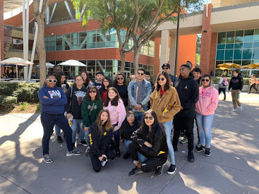 a group of students gathered outside at Central