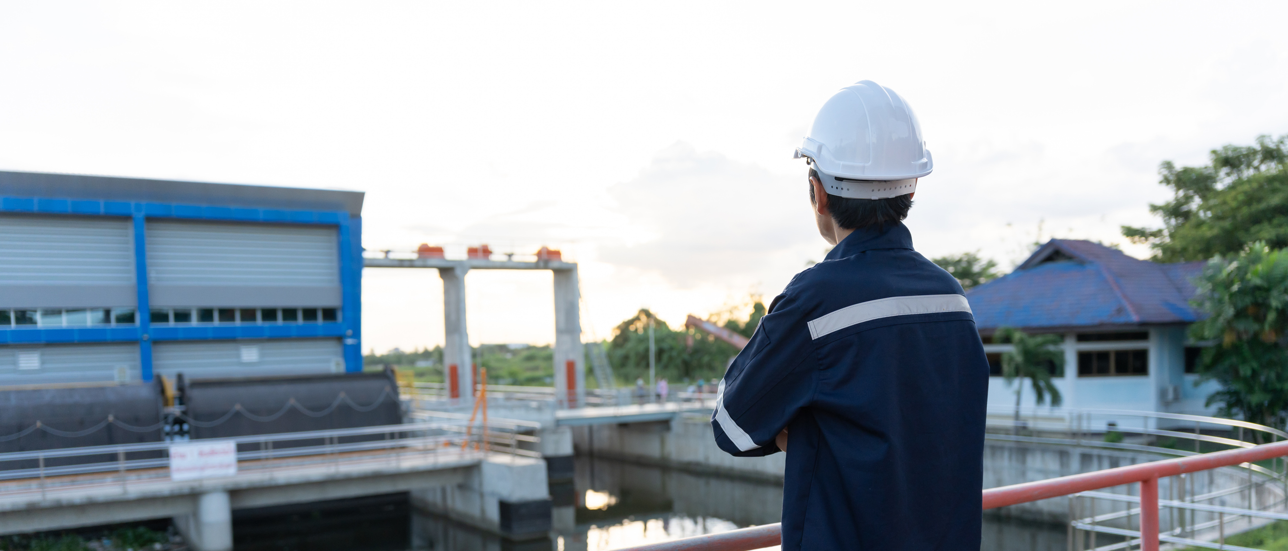 Wastewater engineer overlooking a water treatment facility