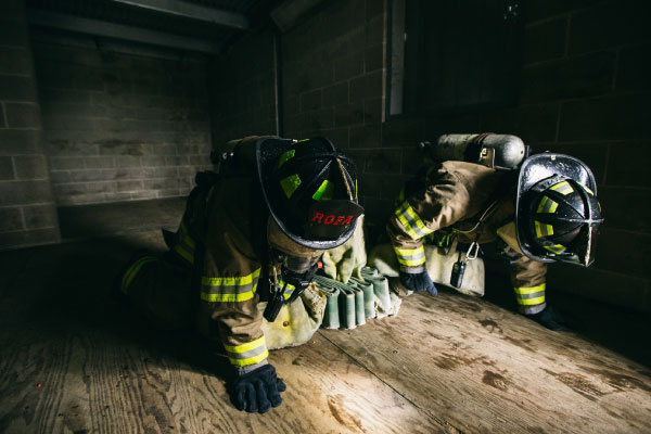 Firefighting student engaging in some training drills